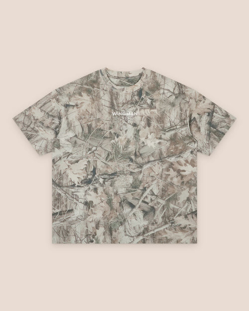 Canopy, front of the tee: tree camo with the wordmark small on the chest