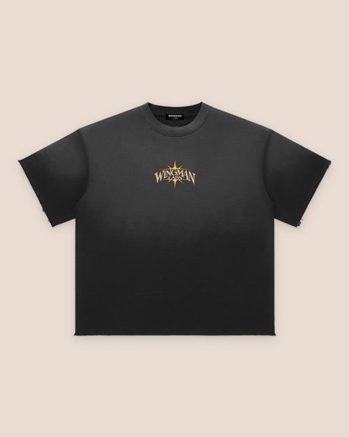 Dawn, front of the tee: sun-faded black with a small Wingman star on the chest